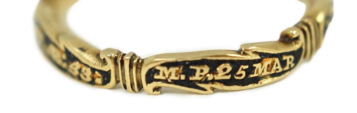 A George II gold, black enamel and rock crystal set mourning ring